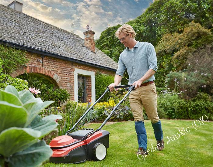 Man Mowing a Lawn - Gardening Month by Month – April