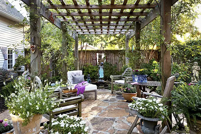 Wooden Pergola with plants over it.