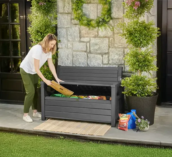 Outdoor Garden Benches with Storage - Women filling a garden storage bench