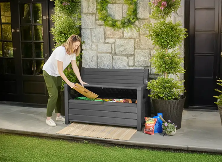 Outdoor Garden Benches with Storage - Women filling a garden storage bench